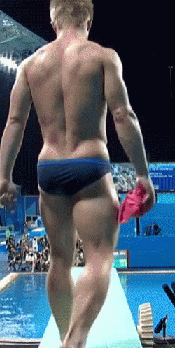 Man in Blue Swim Trunks on Diving Board
