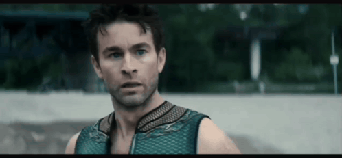 Man in Blue Tank Top Looking at Camera