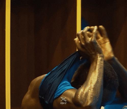 Man in Blue Tank Top With Gif2 Watermark