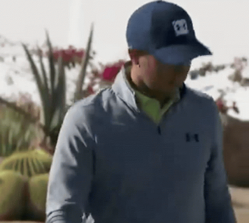 Man In Blue Under Armour Jacket And Hat GIF