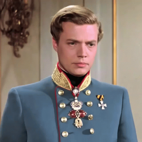 Man in Blue Uniform With Medal and Cross