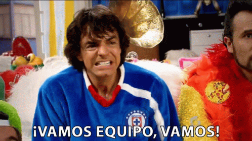 Man in Blue Vamos Equipo Shirt