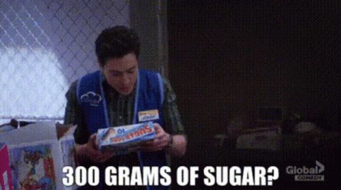Man In Blue Vest Holding Tootsie Pops GIF