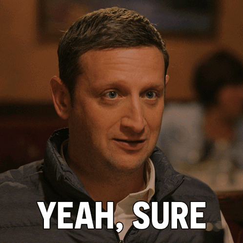 Man In Blue Vest Saying Yeah Sure GIF