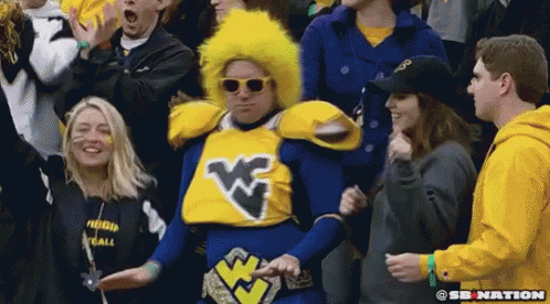 Man in Blue Yellow Costume With W Crowd