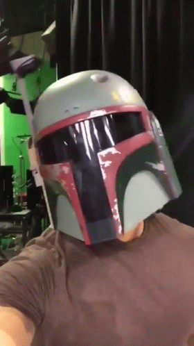 Man In Boba Fett Helmet Looking At Camera GIF