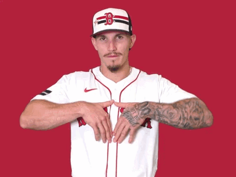 Man in Boston Red Sox Jersey Pointing to Chest
