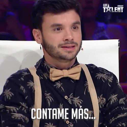 Man in Bow Tie and Suspenders Says Contame Mas