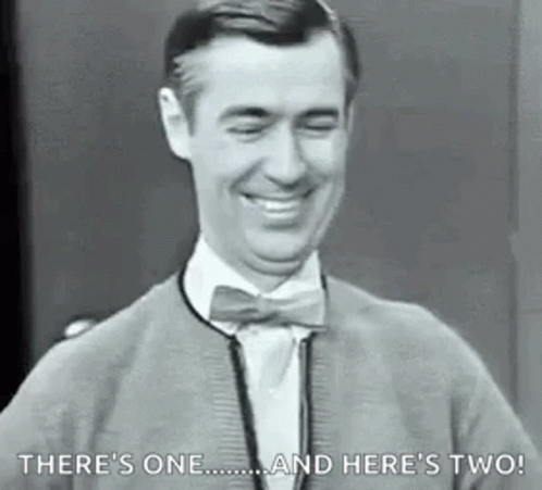 Man In Bow Tie And Sweater Smiling Laughing GIF