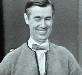 Man in Bow Tie and Sweater Smiling