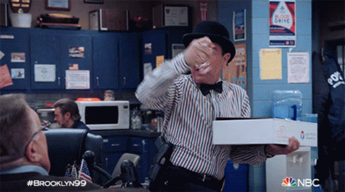 Man In Bowler Hat Holding Pizza GIF