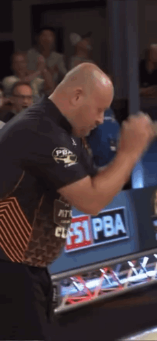 Man in Bowling Shirt With Pba on Sleeve