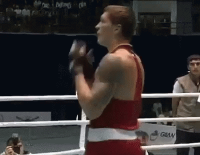 Man in Boxing Ring Holding Glove