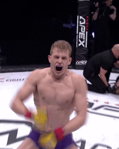 Man In Boxing Ring With Apex Sign GIF