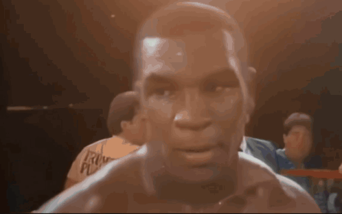 Man In Boxing Ring With Face Tattoo GIF