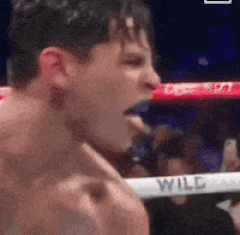 Man in Boxing Ring With Fist in Air
