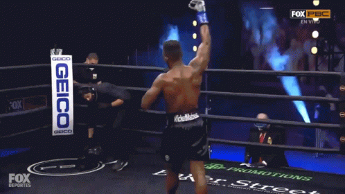 Man in Boxing Ring With Geico Sign