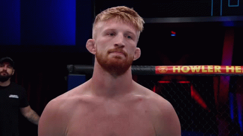 Man In Boxing Ring With Howler Sign GIF