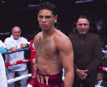 Man in Boxing Ring With Ramos vs Ramirez Sign