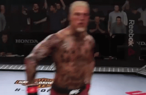 Man In Boxing Ring With Reebok On Wall GIF