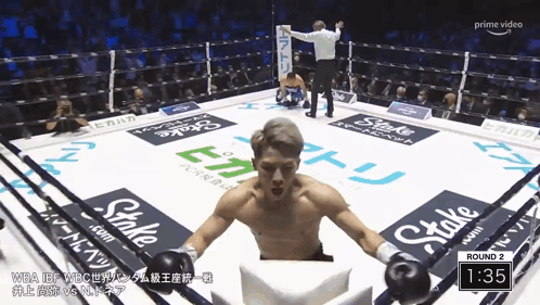 Man In Boxing Ring With Stake Ads GIF
