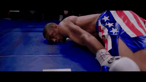 Man in Boxing Ring with Tecate Logo