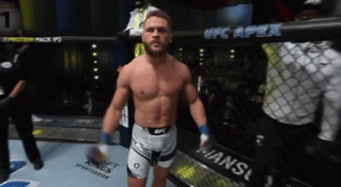 Man in Boxing Ring With UFC Apex Sign
