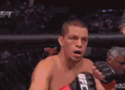 Man in Boxing Ring with UFC Glove