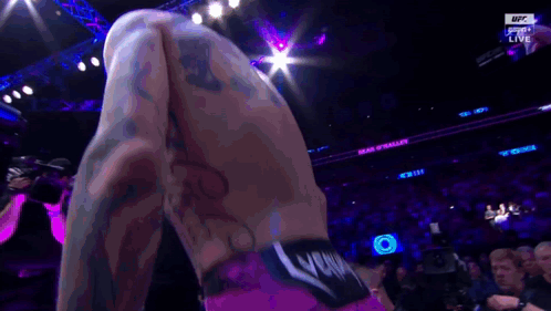 Man in Boxing Ring with UFC Logo