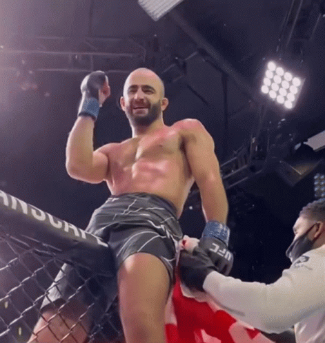 Man In Boxing Ring With UFC Logo Shorts GIF