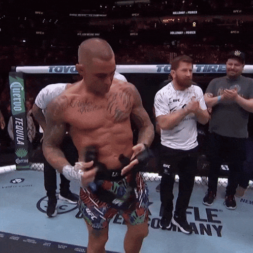 Man In Boxing Ring With UFC Sign GIF