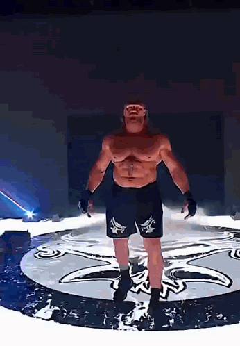 Man in Boxing Shorts Standing in Circle