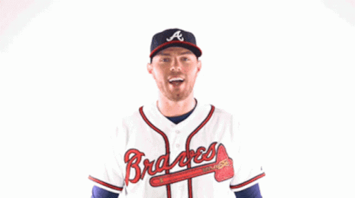 Man In Braves Jersey Flexing Arms GIF