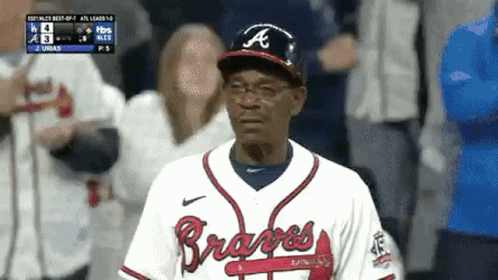 Man In Braves Uniform Standing In Dugout GIF