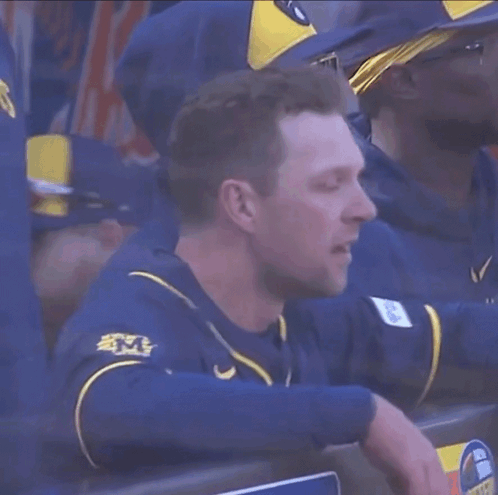 Man in Brewers Jersey Sitting in Dugout