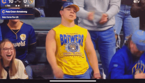 Man in Brewers Shirt Standing
