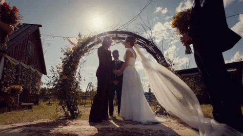 Man in Bride's Dress Looking in Mirror