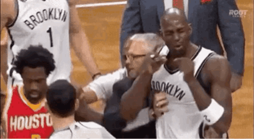 Man In Brooklyn Jersey Talking On Cell Phone GIF