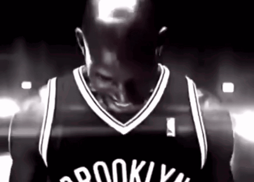 Man In Brooklyn Nets Jersey Smiling Black And White GIF