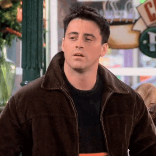 Man in Brown Jacket and Black Sweater