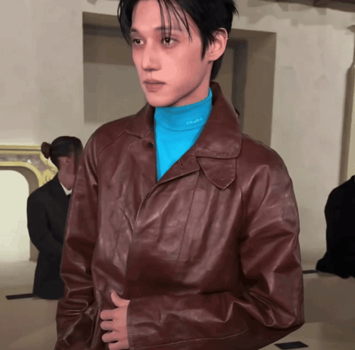 Man in Brown Jacket and Blue Prada Turtleneck