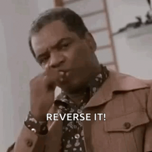 Man In Brown Jacket And Tie Smoking Saying Reverse It GIF