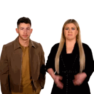 Man in Brown Jacket and Woman in Black Dress
