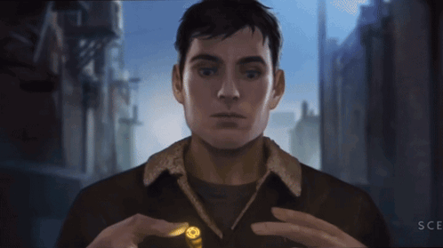Man In Brown Jacket Holding Bullet With Letters SCE GIF