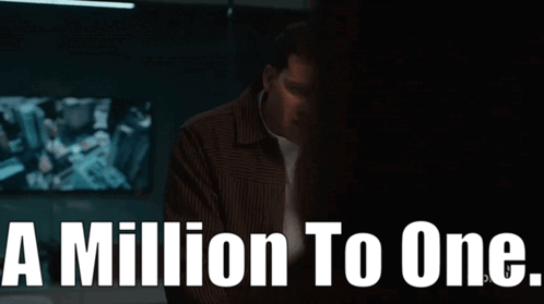 Man In Brown Jacket In Front Of A Million To One Sign GIF