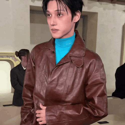 Man in Brown Leather Jacket and Blue Prada Shirt