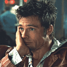 Man In Brown Leather Jacket Hand On Face GIF