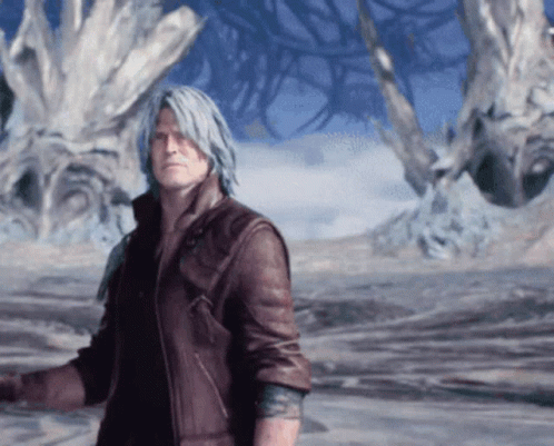 Man in Brown Leather Jacket Standing Before Large Tree