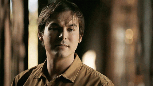 Man in Brown Shirt Close Up