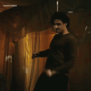 Man in Brown Shirt Dancing Before Curtain #gifscamelli